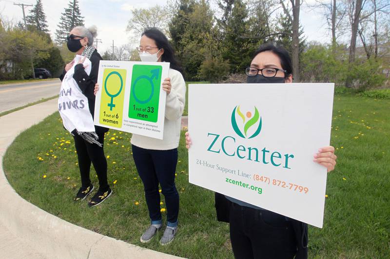 A group of at least 30 people spent an hour April 23 at both of the center’s offices in Gurnee and Skokie silently sharing the personal stories of sexual assault and abuse through signs and T-shirts.